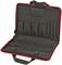 Red tool case with multiple pockets and compartments, opened to reveal interior layout for organised tool storage.