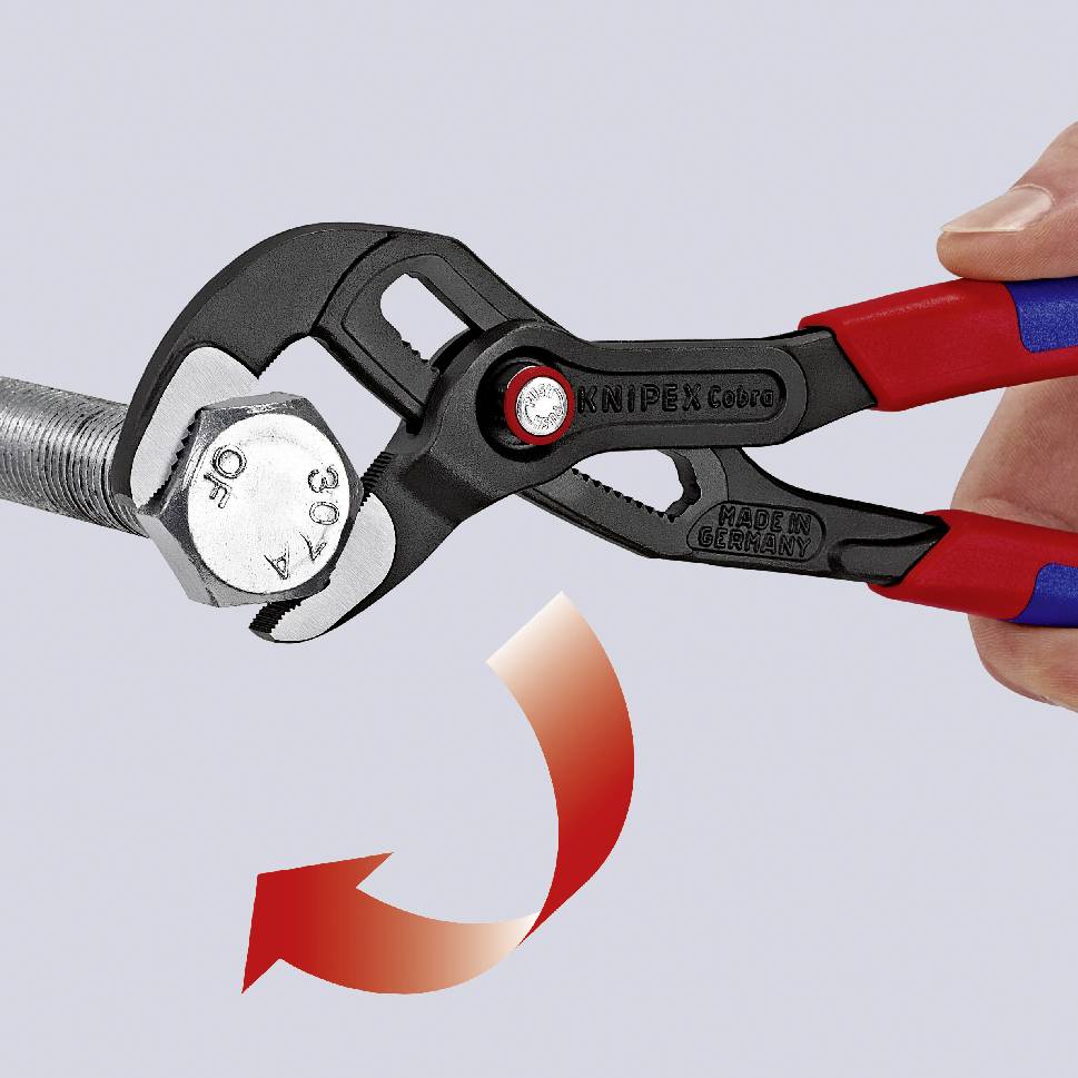 A hand is holding a red and blue pipe wrench, turning a silver hexagonal screw. An arrow indicates the direction of rotation clockwise.