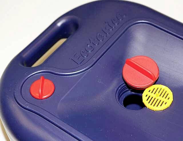 A blue jerry can with a red and yellow cap on the top.