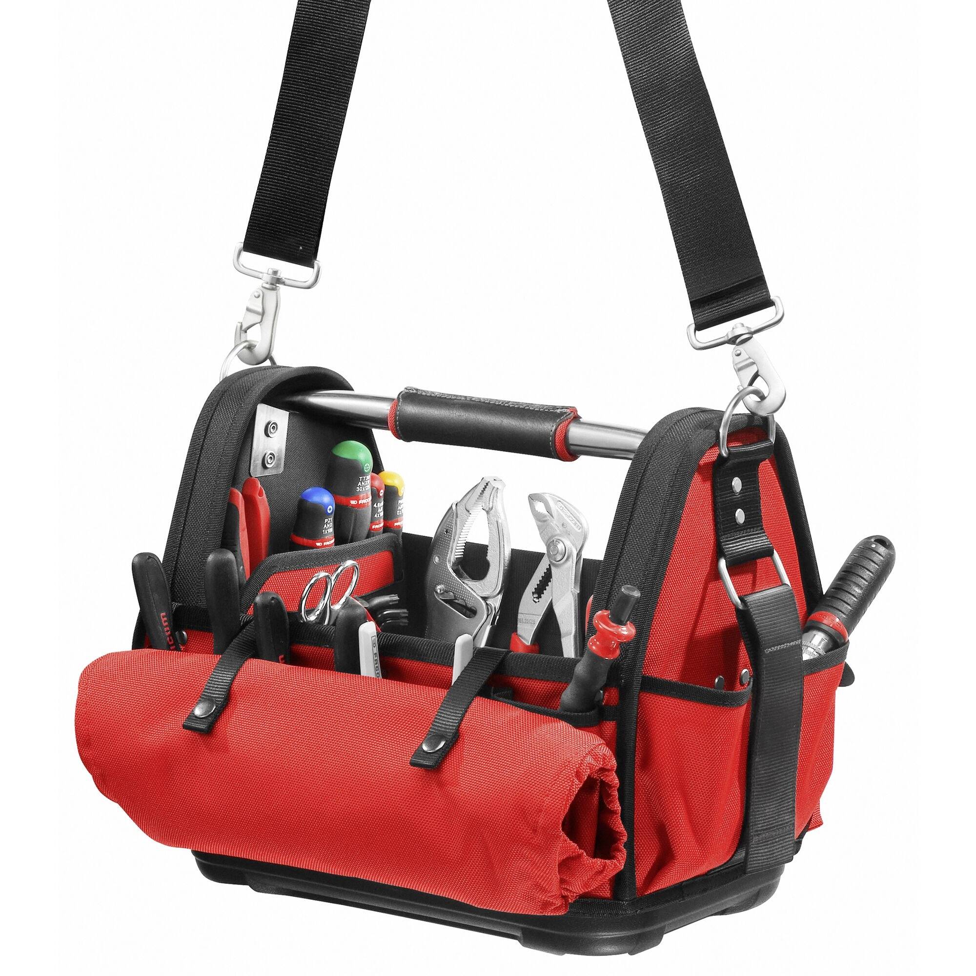 A red toolbox with various tools such as pliers, screwdrivers and spanners, organised in compartments.