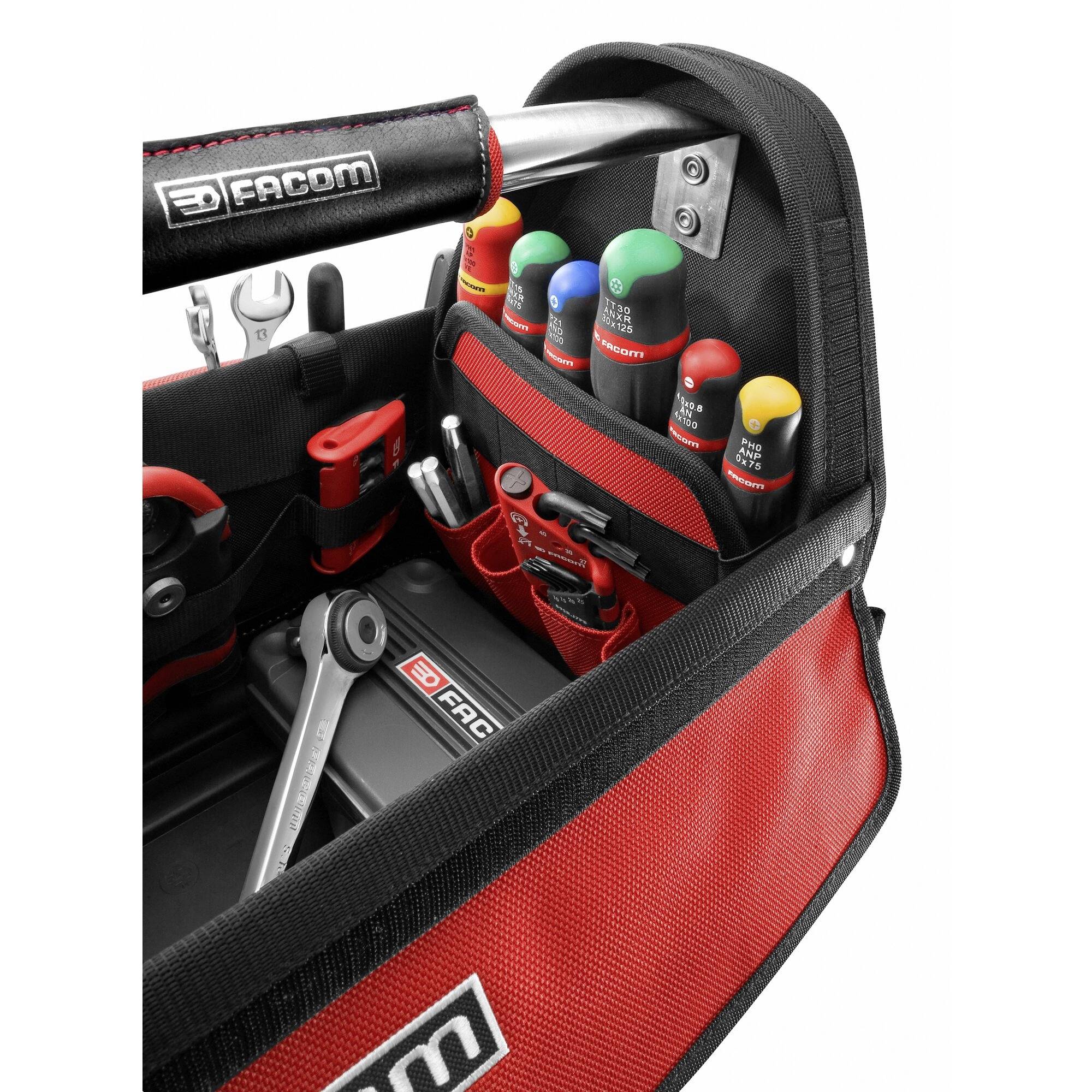 An open toolbox with various tools such as spanners, screwdrivers and pliers, lined up in holders.