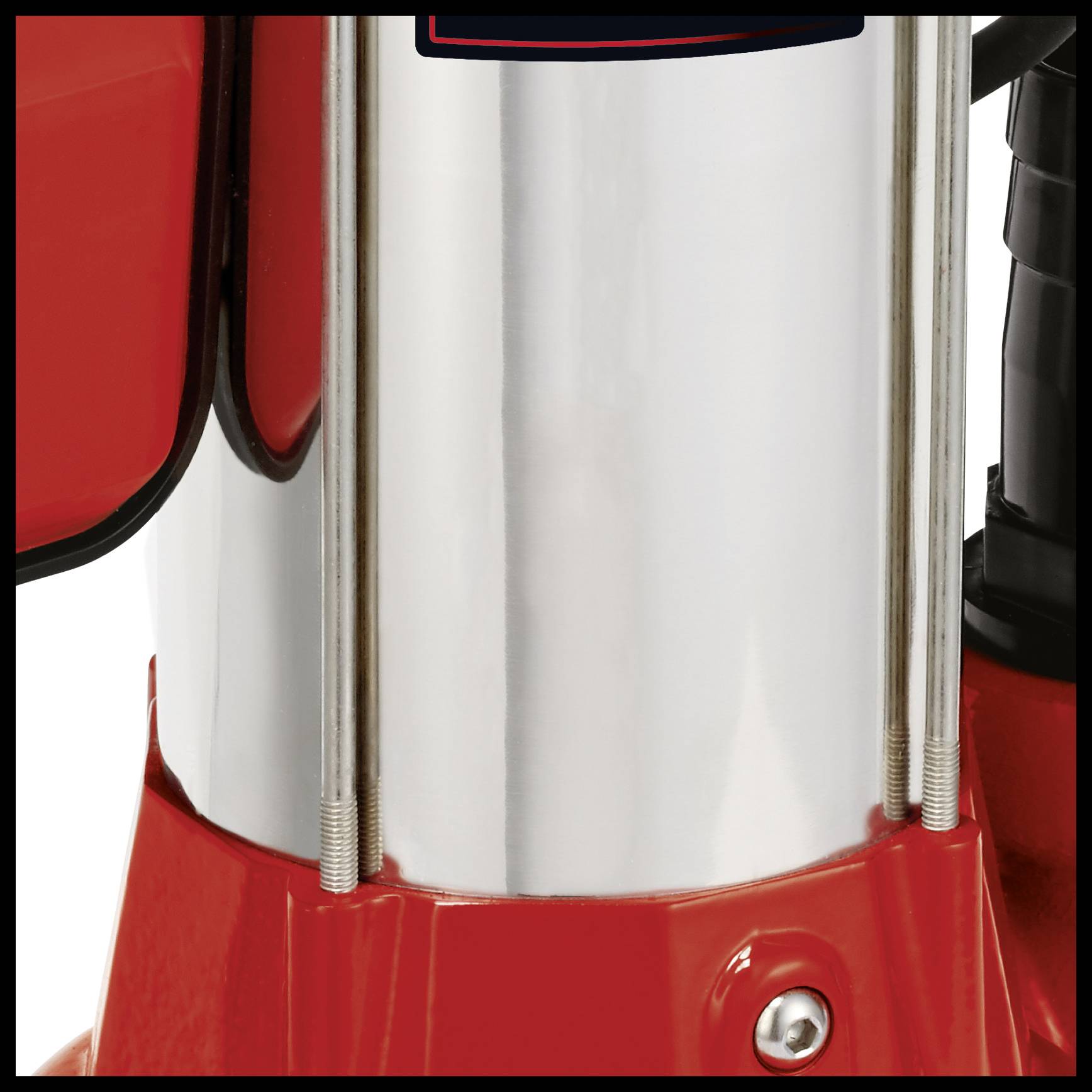 Silver, shiny metal component with red and black elements, possibly part of a machine or technical device.