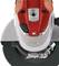 A red and silver angle grinder, closely photographed. It shows the rotating grinding disc and the front part of the housing.