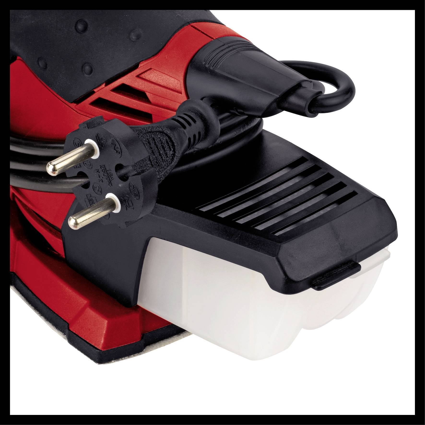 Close-up of a black and red electrical device with power cable and plug.