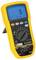 Yellow digital multimeter with large display, showing '5 A'. Device displays measurement ranges and function settings.