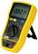 A yellow multimeter shows a reading of -0.02 millivolts. It has multiple modes and setting options for different voltage types.