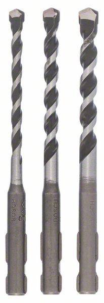 Three drill bits side by side in different sizes on a light background. They are suitable for use in electric drills.