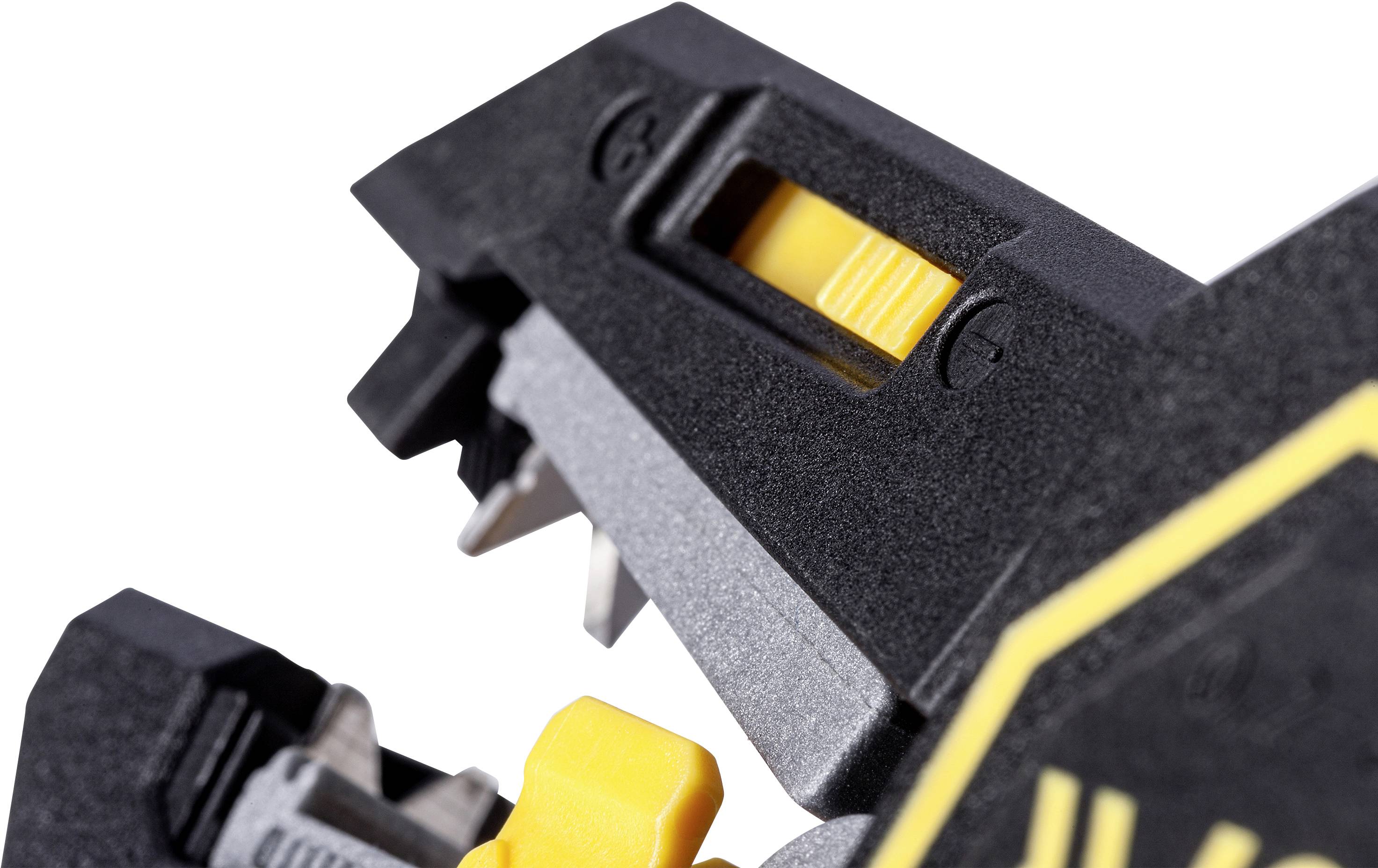 Close-up of a tool with black and yellow plastic components. It shows a yellow sliding lock and metal edges.