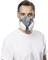 A person is wearing a grey respiratory mask with white filters and a white T-shirt.