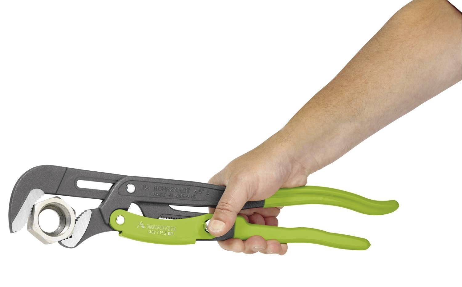 A hand is holding a large green pipe wrench, gripping a piece of metal. The wrench is held at a right angle to the hand.