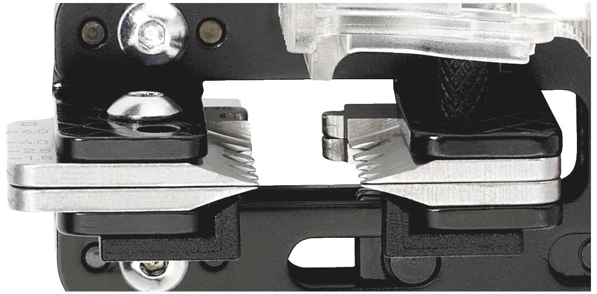 Close-up of a black metal tool with serrated clamps facing each other. It appears designed for securing materials.