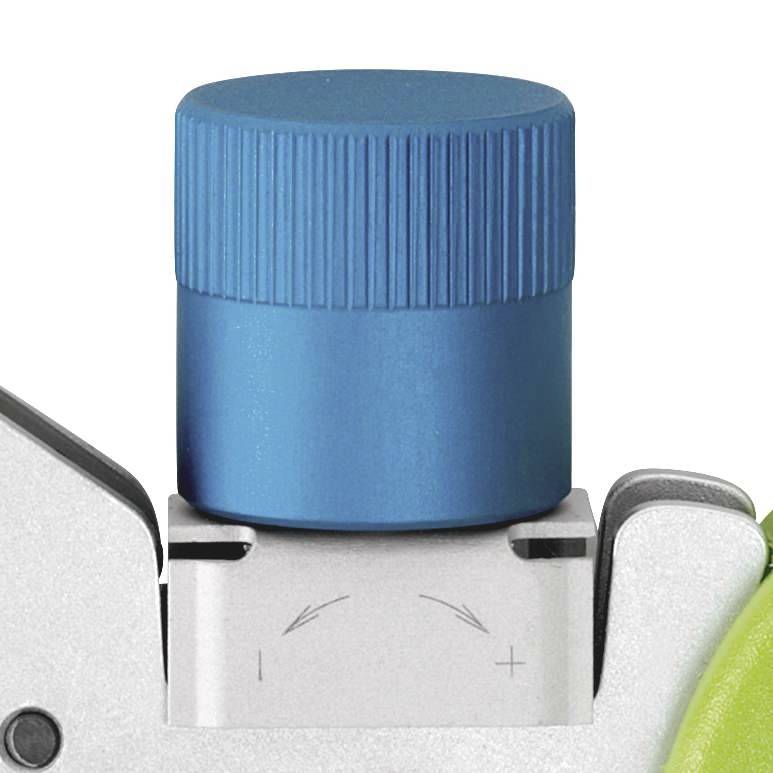 Close-up of a blue button on a device with plus and minus symbols, with arrows pointing to a settings function.