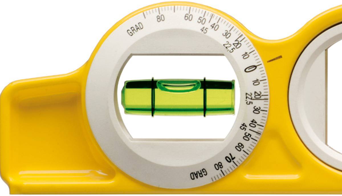 A spirit level with a yellow casing and green vial indicates balance to measure horizontal alignment.