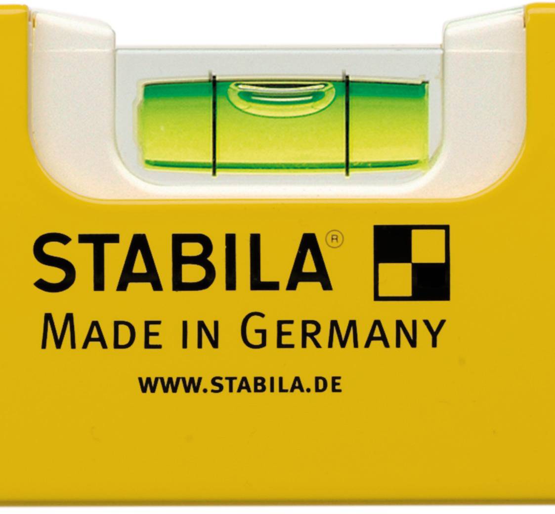 Spirit level with a yellow casing, marked with 'Stabila Made in Germany'. A green vial indicates the horizontal alignment.