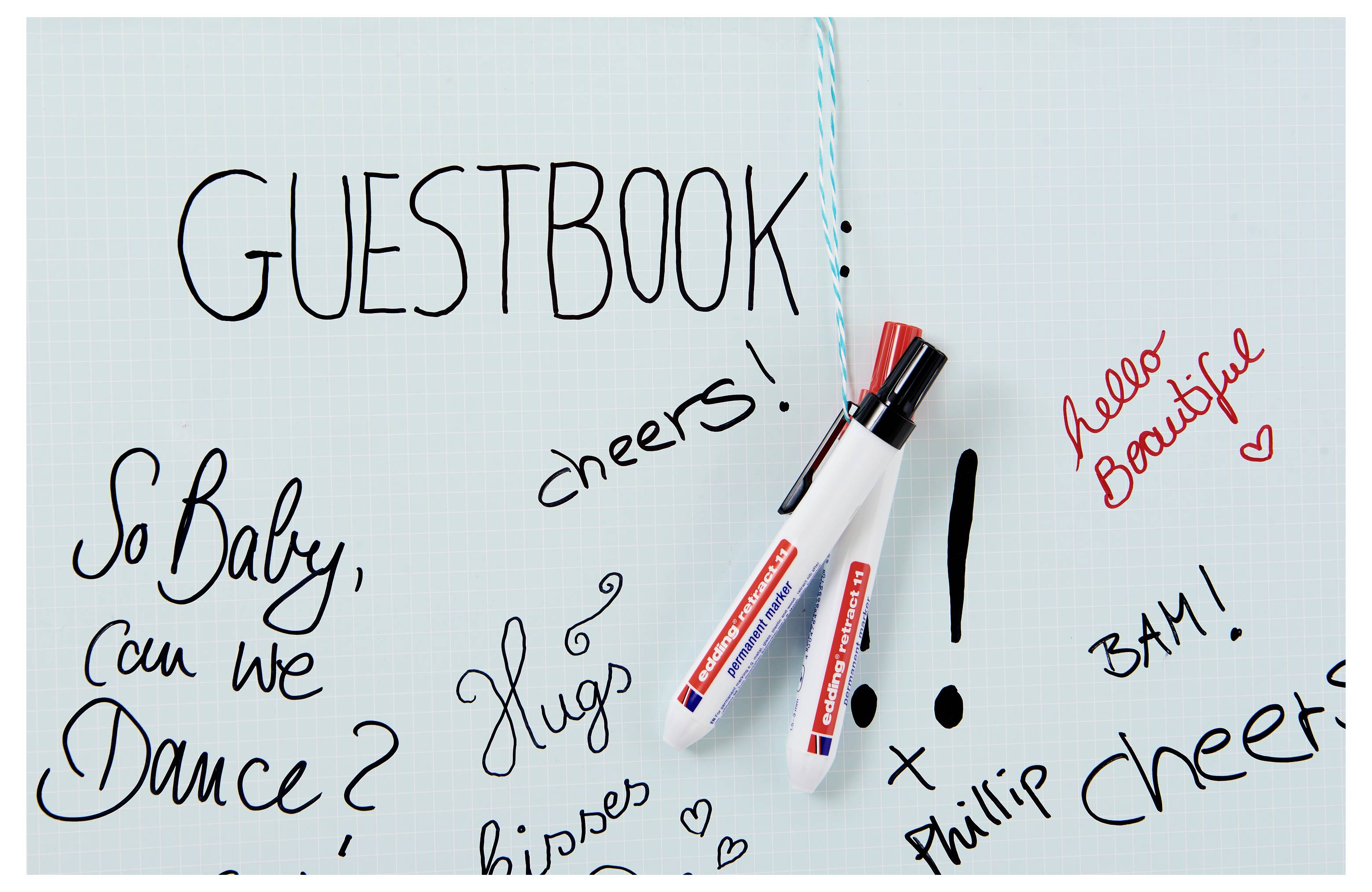 Guestbook page with handwritten messages and doodles, including 'GUESTBOOK', 'So Baby, can we Dance?', 'hello Beautiful', and 'BAM!' around markers.
