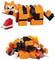 Two Lego cats: The top cat is standing and holding a red mug; the lower cat is assembled lying on the floor. Both are orange with black stripes.