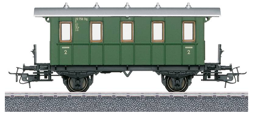 A vintage green passenger railway carriage with a silver roof, labeled '2' on the sides, stands on railroad tracks with four small windows.