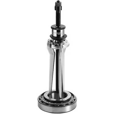 A mechanical tool used for extracting or installing bearings, featuring a central threaded rod, grip arms, and a circular bearing at the base.