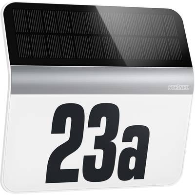 The image shows a house number '23a' on an illuminated sign with an integrated solar panel at the top, useful for house identification at night.