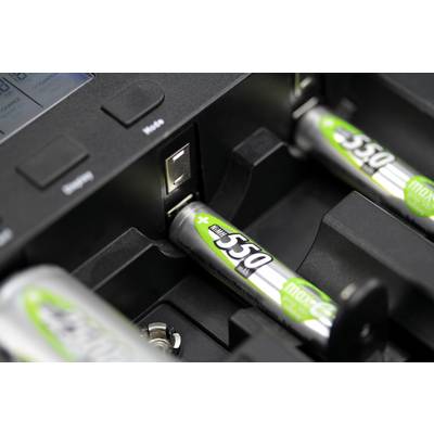 Close-up of rechargeable AA batteries in a charger. One battery shows the inscription 'maxe 550', with other batteries partially visible.