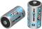 Two silver Ansmann batteries, type HR20, with 1.2V and a capacity of 8500 mAh, are standing upright next to each other.