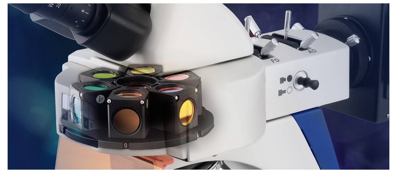 Microscope with rotating colour filters used for sample analysis. Rotary knobs and levers for control are visible.