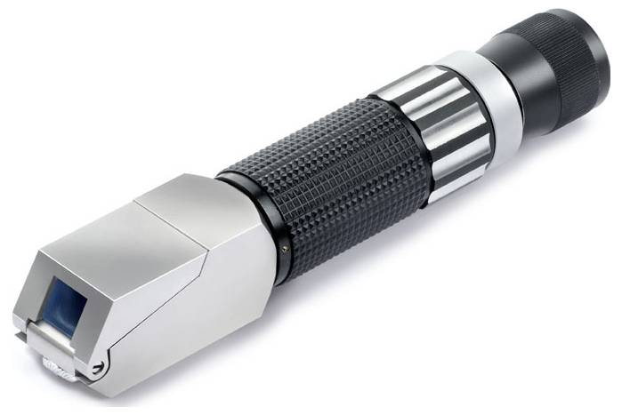 A metallic cantilever illuminates a work surface. Suitable for precision work in laboratories or workshops.