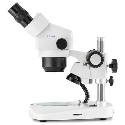 A white stereo microscope with a black eyepiece and adjustable stand. It features rotary knobs for focusing and alignment.