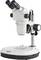 Microscope with two eyepieces and magnification control on a white background. Suitable for laboratory or scientific investigations.