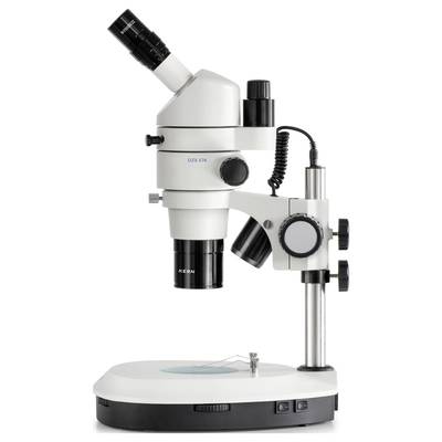 A white stereo microscope with black eyepiece and controls stands on a stable base, suitable for scientific investigations.