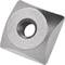 A cube-shaped metal insert with a round, notched opening in the centre, used for turning or milling workpieces.
