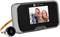 Digital door viewer with display shows an image of people laughing. Contains camera and monitor for surveying the outside area.