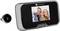 Digital door viewer with display showing a photograph of three laughing people. The camera of the door viewer is visible to the left.