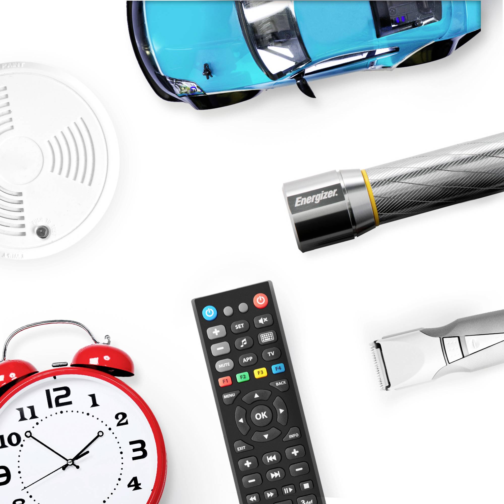A top-down view shows a smoke detector, a toy car, a torch, a remote control, an alarm clock, and a hair clipper.