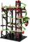 A complex marble run construction kit made from black, red, and green building blocks, with multiple levels and loops for creative constructions.