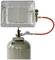 Gas heater with metal grill, attached to a propane gas cylinder, with red connecting hose and regulator.