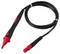 A black and red test probe cable with pointed tip and connector, coiled and ready for use in electrical testing tasks.