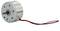 A small, round electric motor with a metal casing and two protruding, coloured cables is used for power supply in devices.