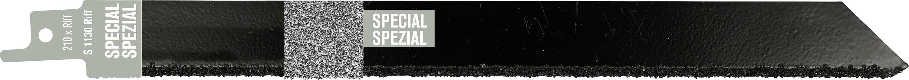 Black textured tape strip with gray labels reading SPECIAL and SPEZIAL, ending in a tapered pointed tip.