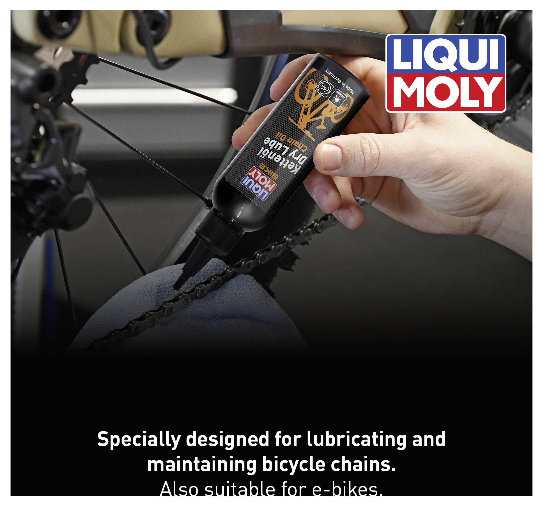 A hand applies chain oil to a bicycle chain. The 'LIQUI MOLY' logo is located in the top right. Text below: 'For lubricating and maintaining bicycle chains.'