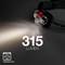 A head torch emits light. Inscription '315 Lumens'. Brand logo in bottom left.