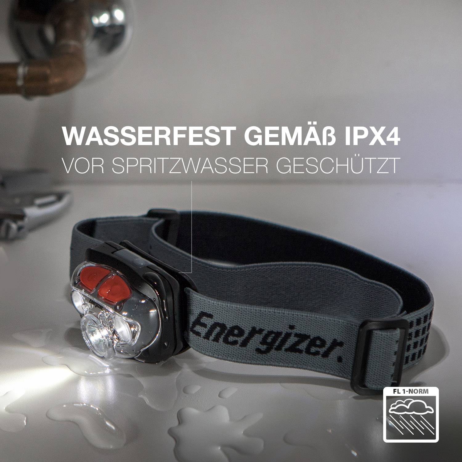 A black head torch on a table. The text 'Waterproof to IPX4 standard, protected from splashing water' is displayed above it.