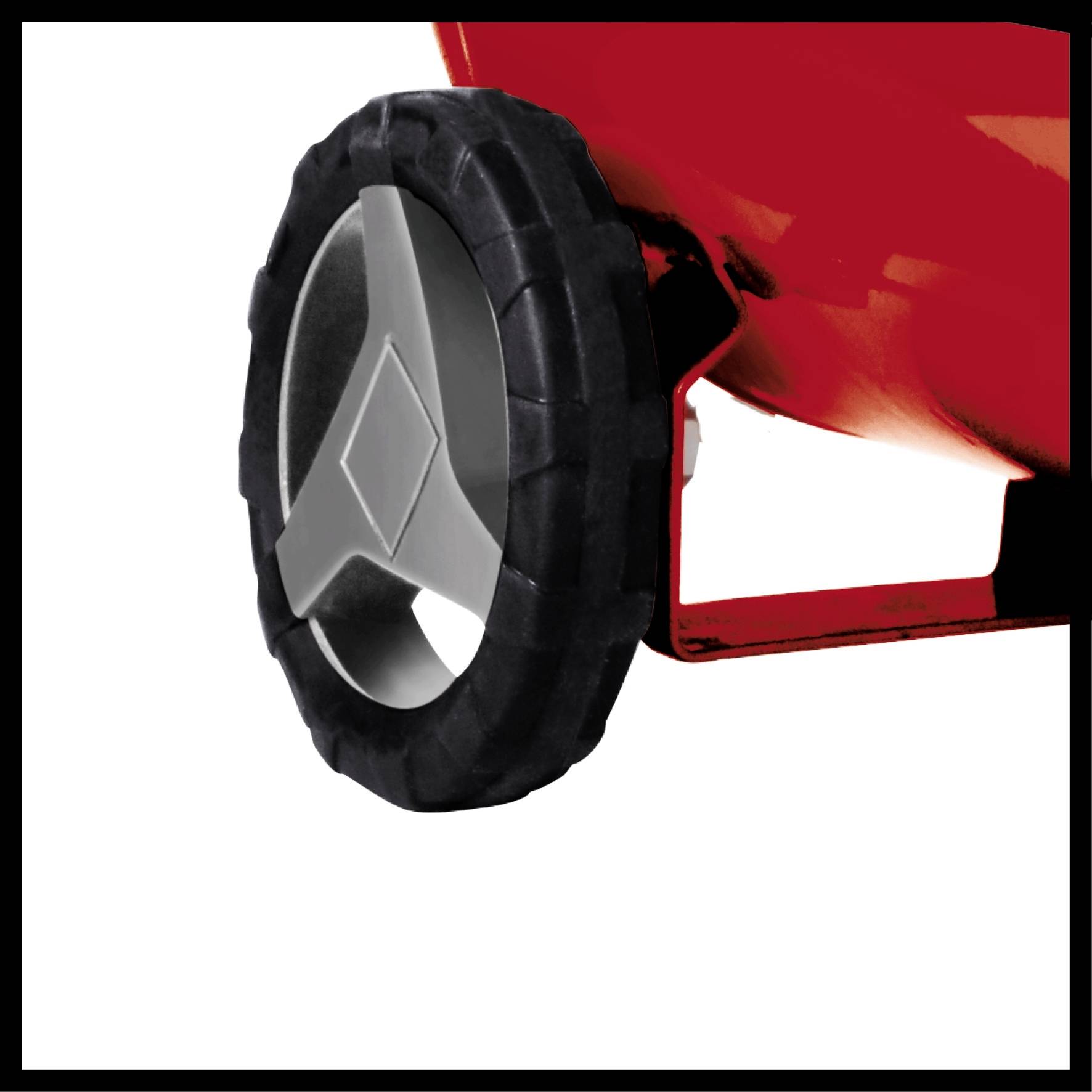 A red device with a large, black wheel is shown in close-up. The wheel has a silver insert, likely part of a gardening tool.