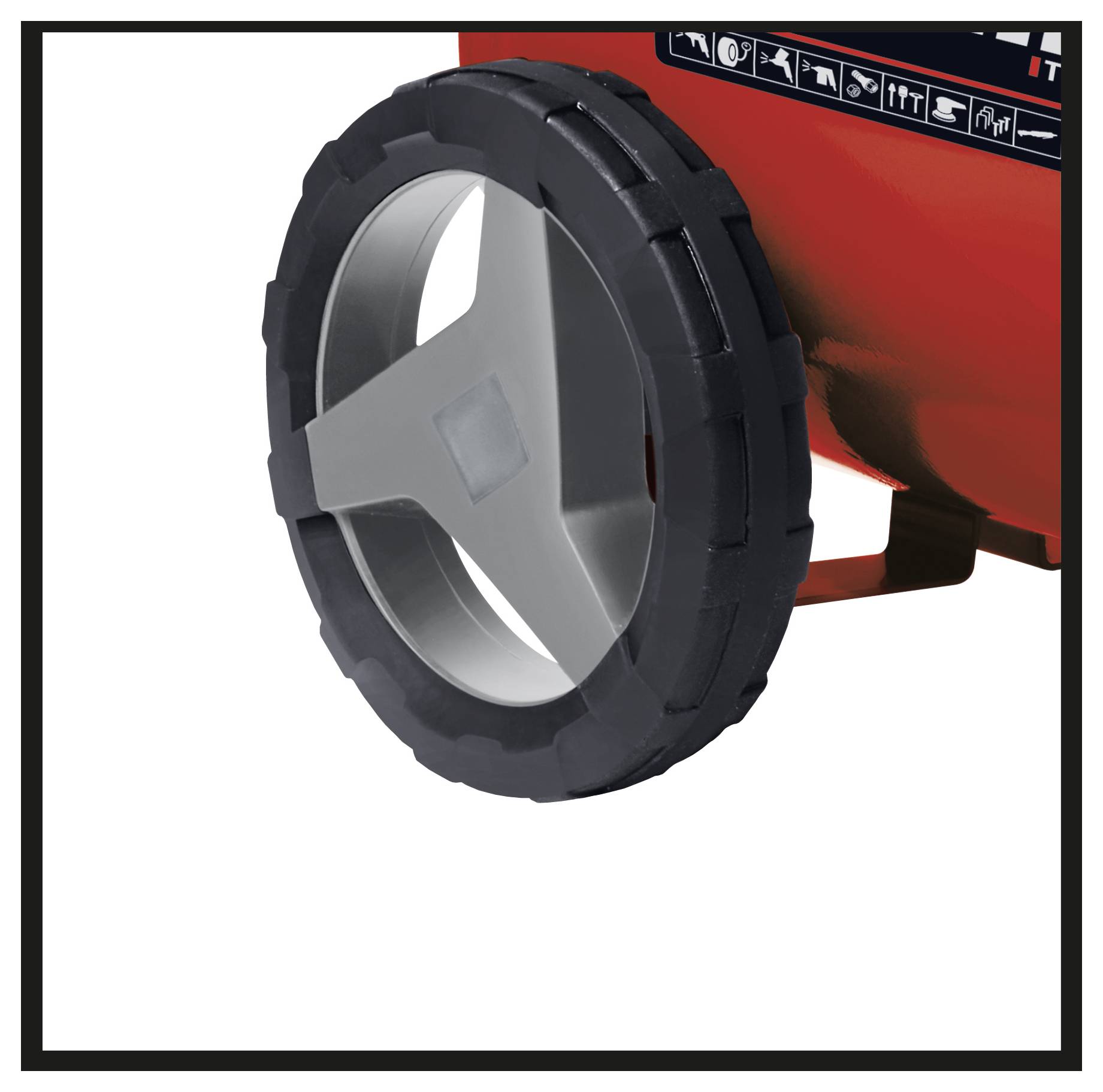 Close-up of a red machine or cart’s wheel, showing a black tire and silver three-spoke rim.<br>