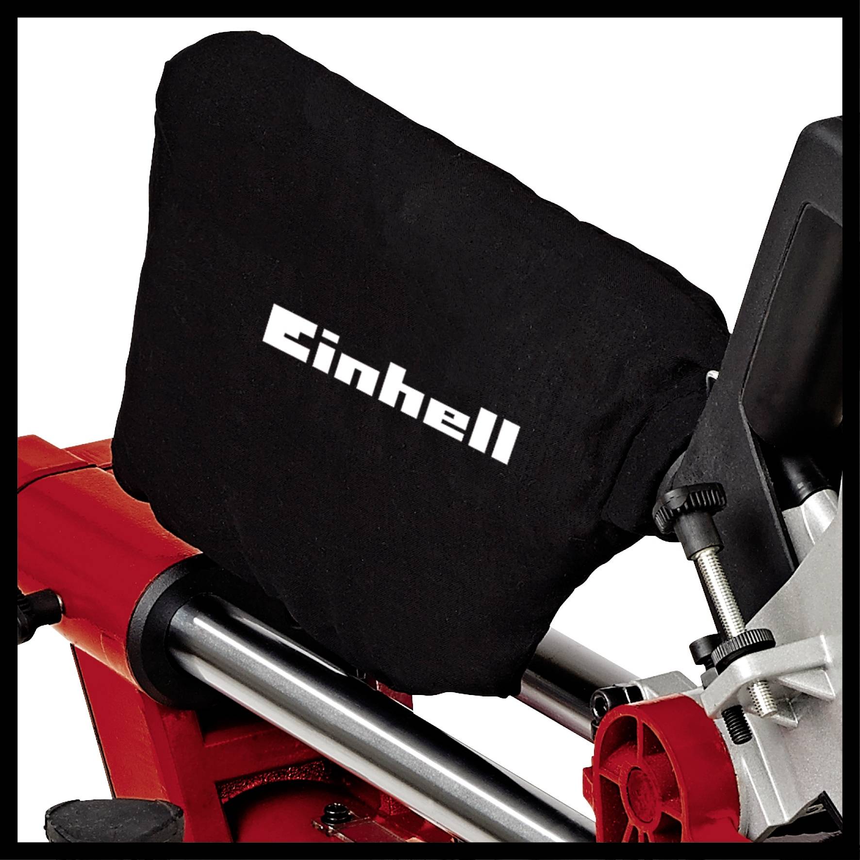 Einhell saw cover on a saw, protecting the device. Black cover with white Einhell logo, red and black machine housing.