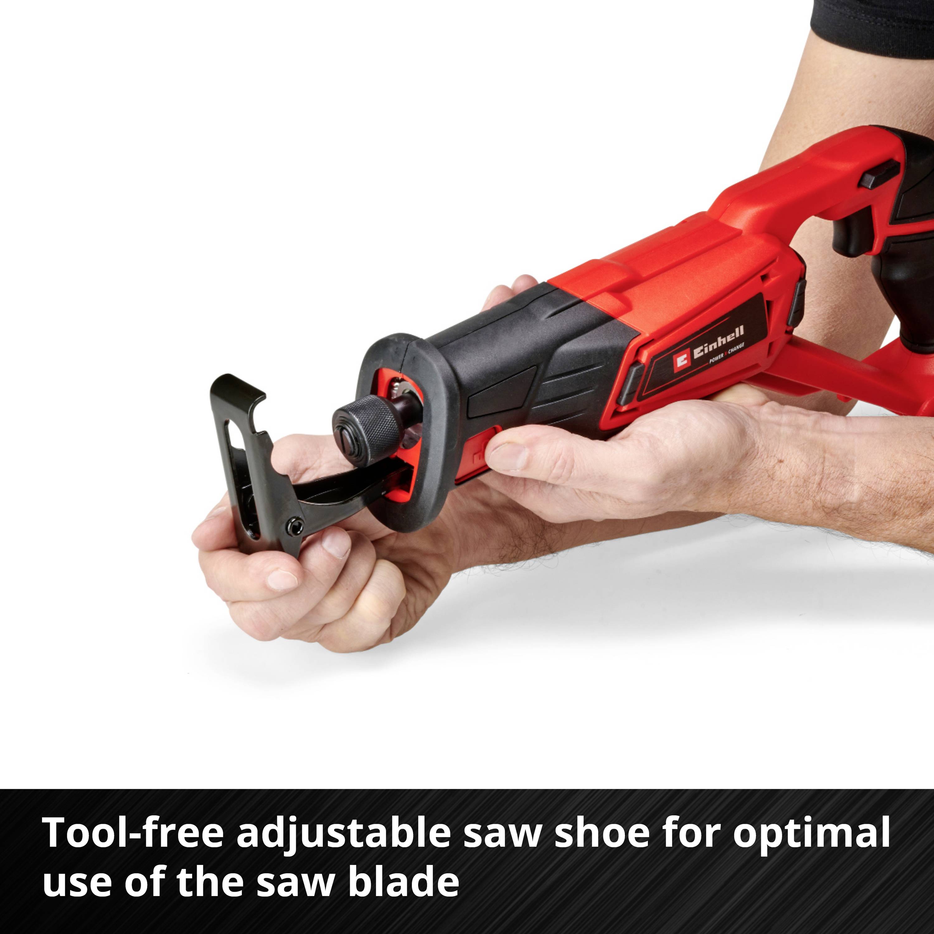 A hand is holding a red reciprocating saw with an adjustable shoe to demonstrate optimal use of the saw blade.