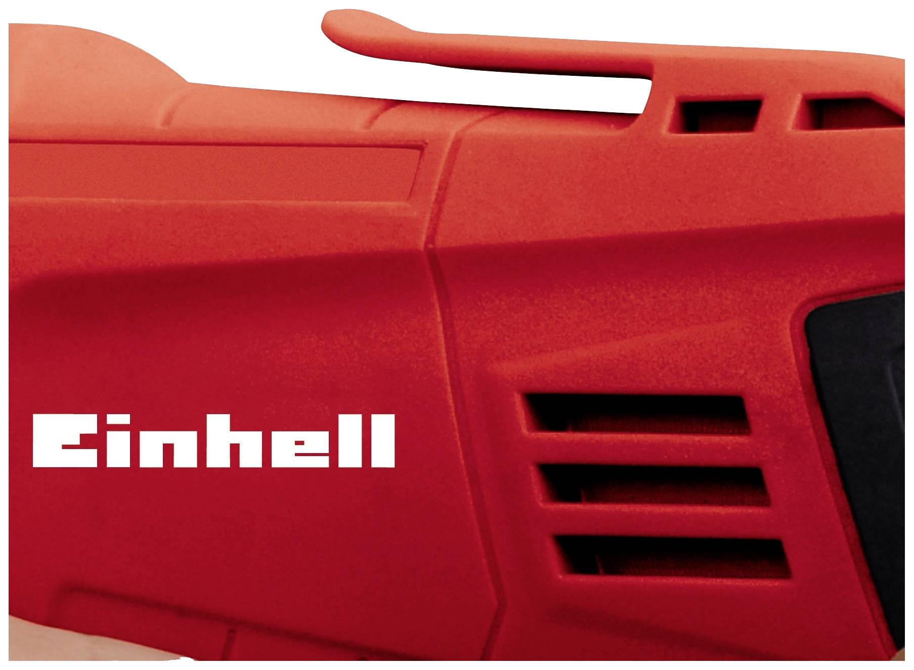 Close-up of a red electrical device with the 'Einhell' logo on the right. The focus is on ventilation slots and ergonomic handle design.