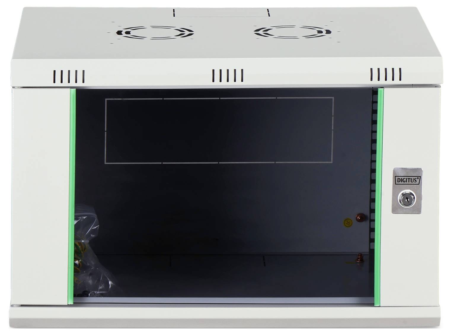 A white metal cabinet with ventilation slots and a locking mechanism on the right side, standing open and empty except for some wiring.