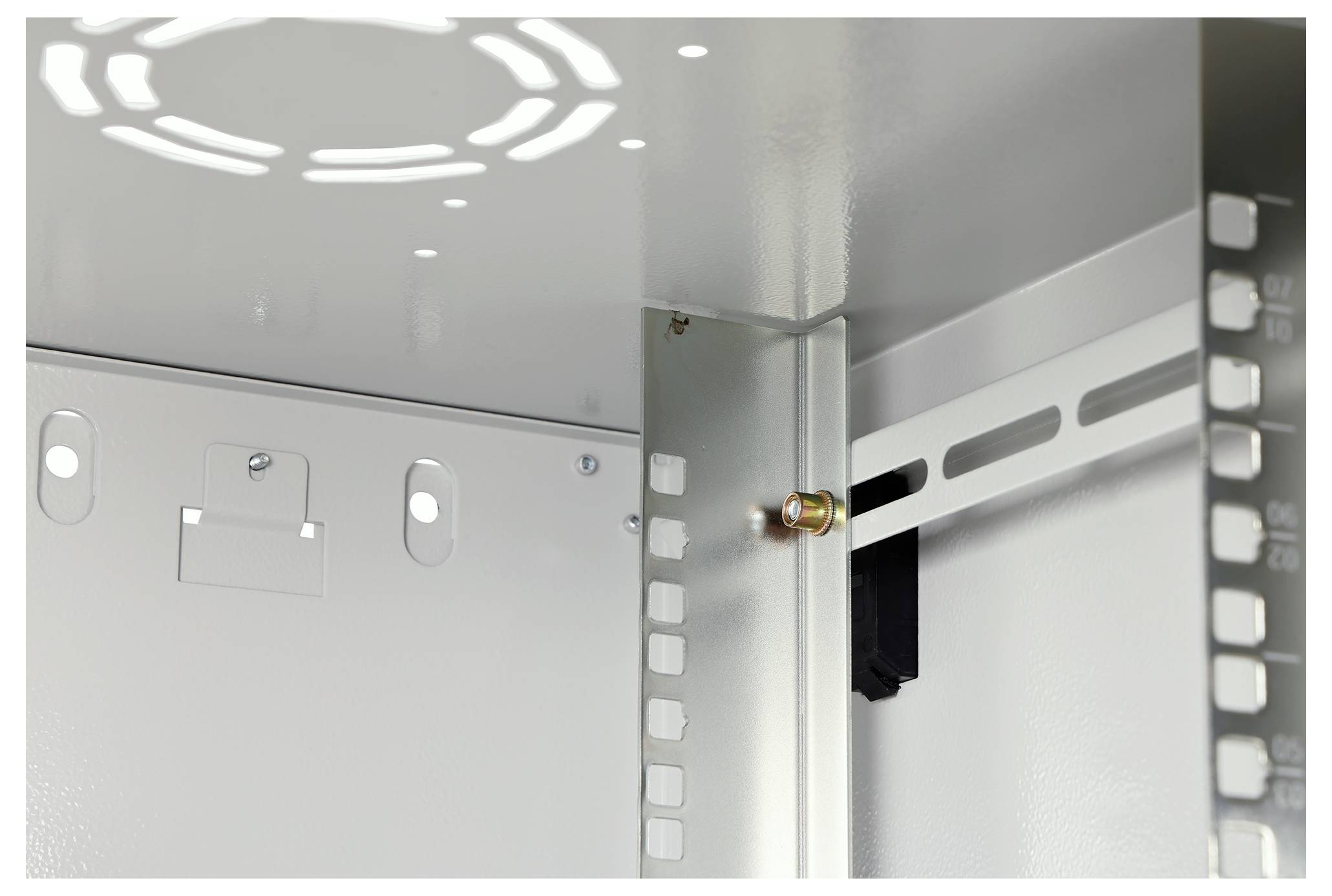 Interior of a metal cabinet showing a mounted electronic component and support brackets, with light shining through a ventilated top.