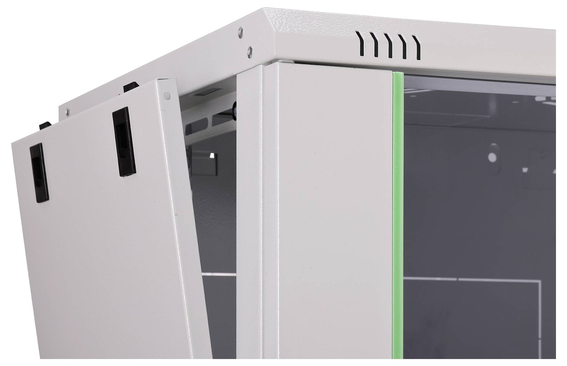 A close-up view of a white metal cabinet with an open door, featuring ventilation slits and a green edge on the right side.